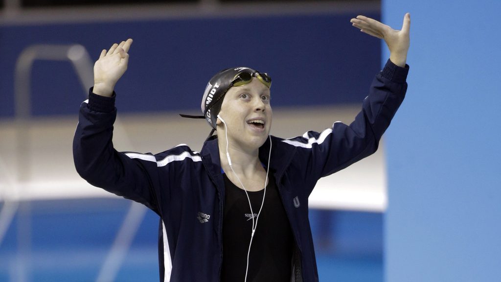 Sierra Schmidt of the United States dances before the start of the women's 800 meter freestyle swimming event at the Pan Am Games Saturday, July 18, 2015, in Toronto. Schmidt won the gold medal in the event. (AP Photo/Mark Humphrey)
