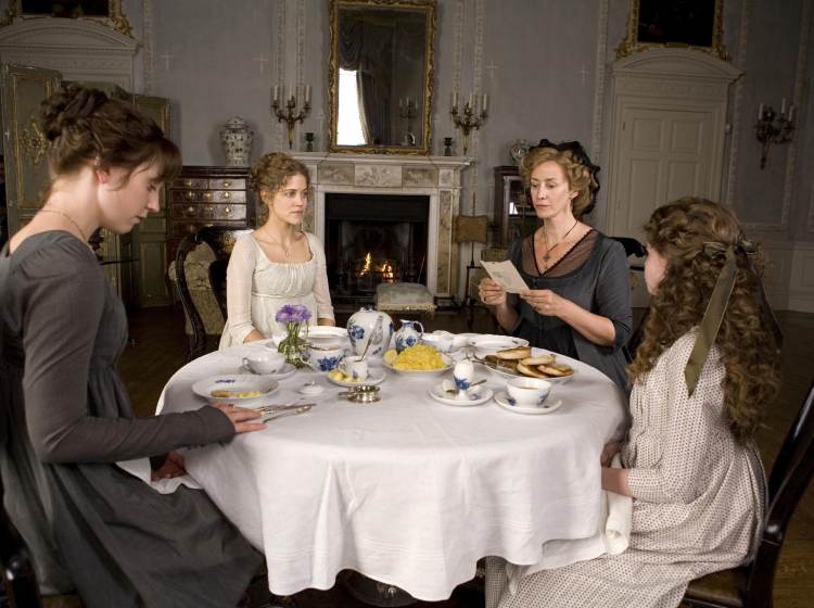 Hattie Morahan (as Elinor Dashwood), Charity Wakefield (as Marianne Dashwood), Lucy Boynton (as Margaret Dashwood), and Hanet McTeer as Mrs. Dashwood gathered around a table in Sense and Sensibility