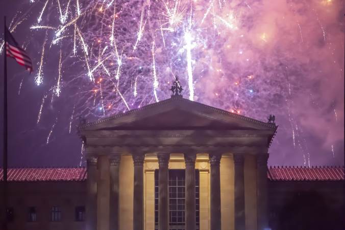 Fireworks cascade behind the central portico of the Philadelphia Museum of Art on July 4, 2021.
