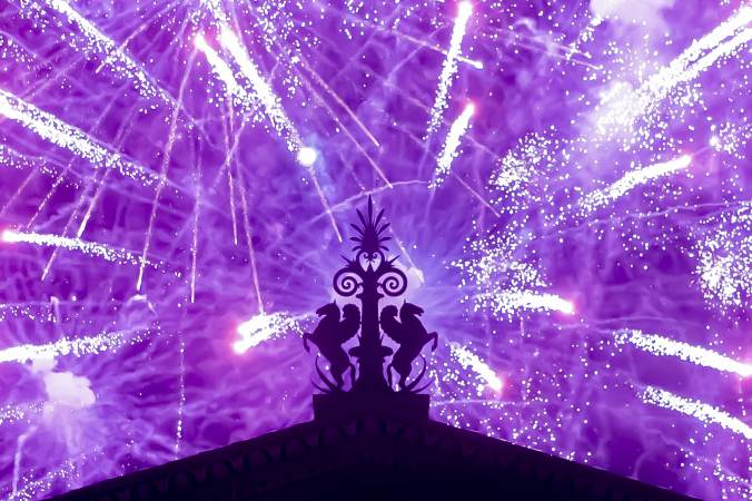 Fireworks explode in the background behind a gargoyle atop of the central portico of the Philadelphia Museum of Art on July 4, 2021.