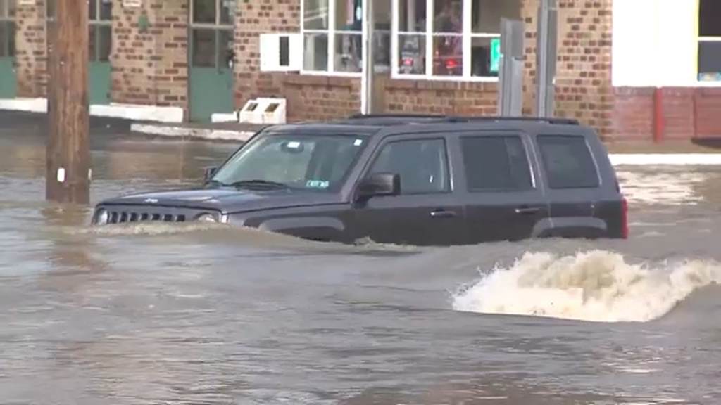 10883278_flooding-feature Aa car is pictured in heavy floodwaters