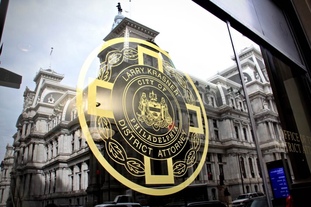 2021 03 12-e lee-philadelphia district attorneys office-city hall reflection Philadelphia City Hall is reflected in the windows of the Office of the District Attorney. (Emma Lee/WHYY)