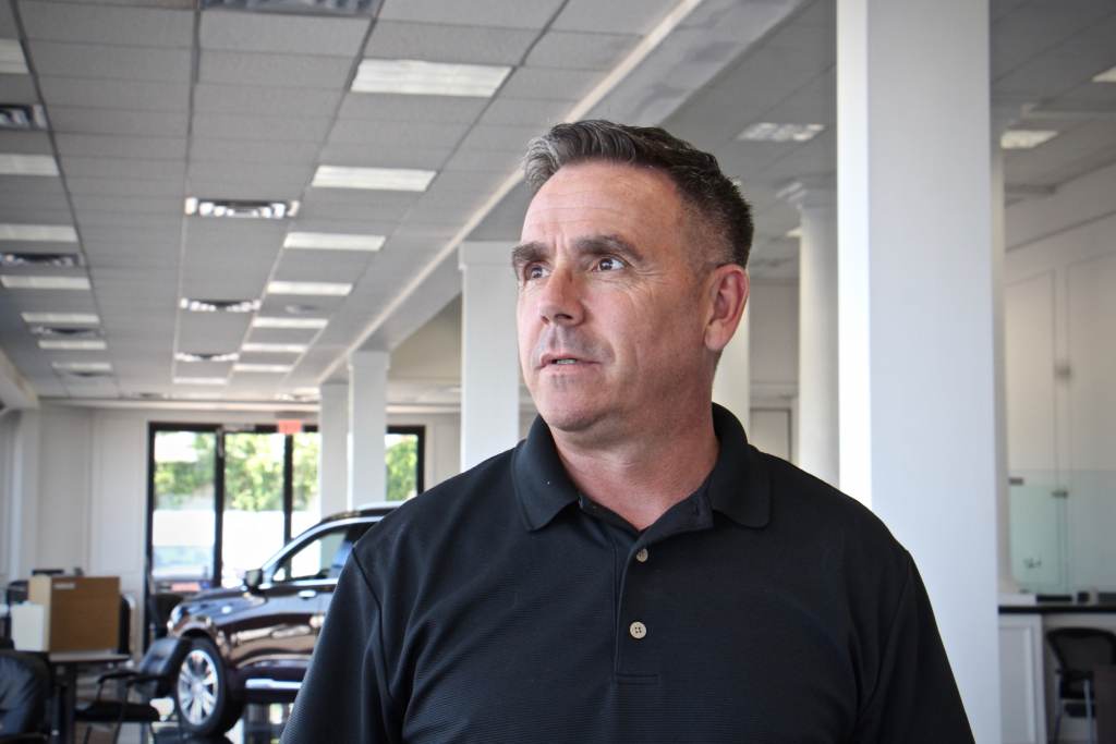 David Long stands inside a building