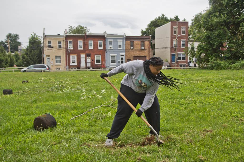 Brandy Fortune plants a tree in North Philadelphia