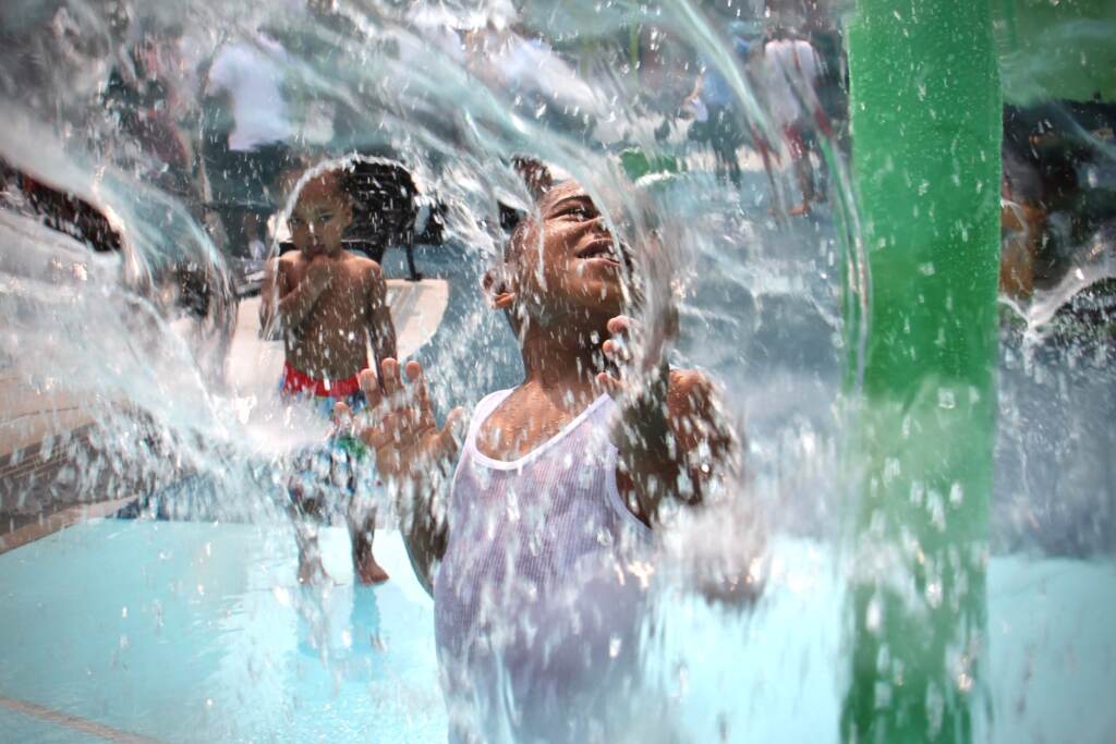 2021 07 21-elee-mesiah clark-philadelphia 8th and diamond-rebuild playground Mesiah Clark splashes around at a sprayground in Philly