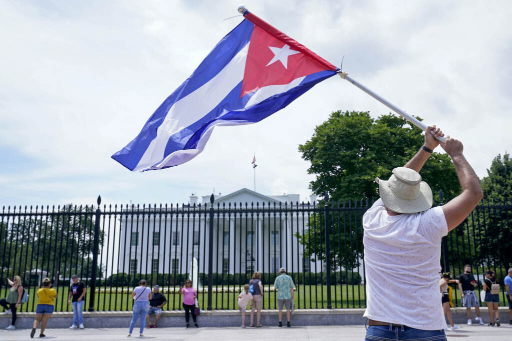 Biden Cuba Haiti A person flies a Cuban flag outside the White House