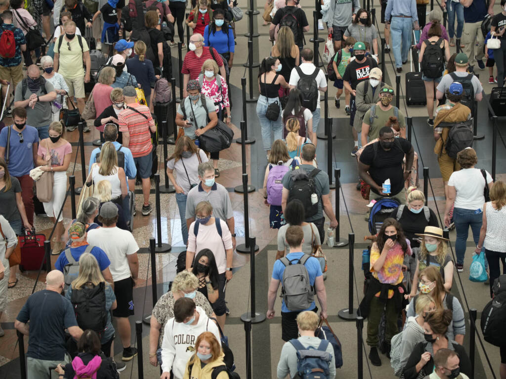 Travel US-Europe Travelers queue up in long lines to pass through an airport security checkpoint