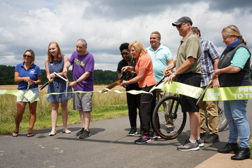 Burlington County officials and representatives from partnering organizations cut the ribbon on the new Delaware River Heritage Trail Bypass 130 Burlington County officials and representatives from partnering organizations cut the ribbon on the new Delaware River Heritage Trail Bypass 130. (Kenny Cooper/WHYY)