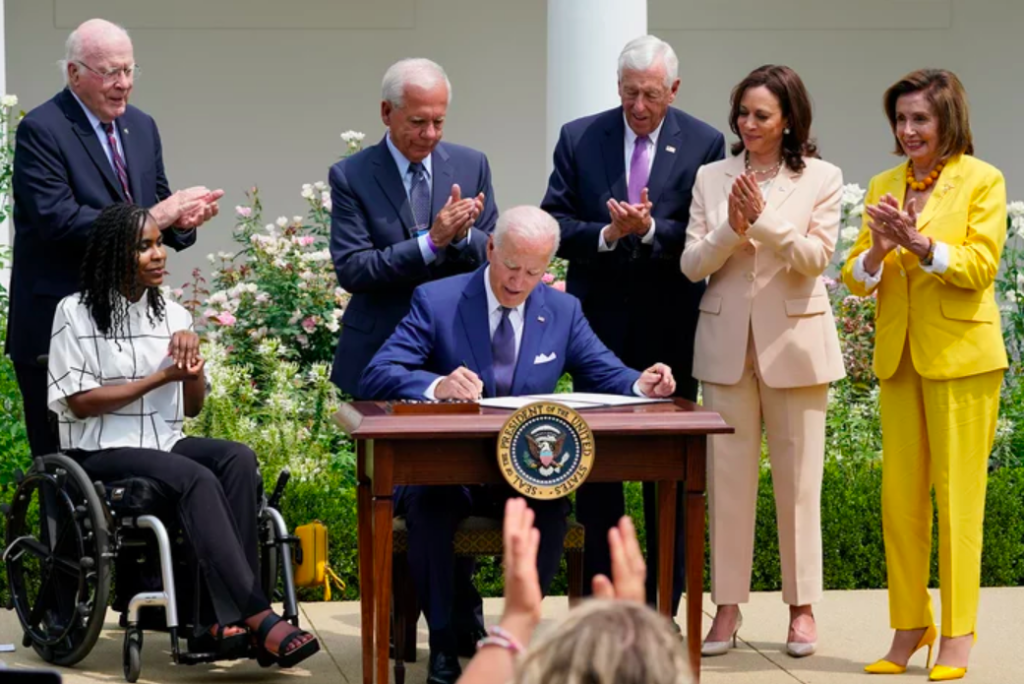 Screen Shot 2021-07-31 at 10.27.17 AM President Joe Biden, center, signs a proclamation during an event in the Rose Garden of the White House in Washington, Monday, July 26, 2021, to highlight the bipartisan roots of the Americans with Disabilities Act. (Susan Walsh/AP)