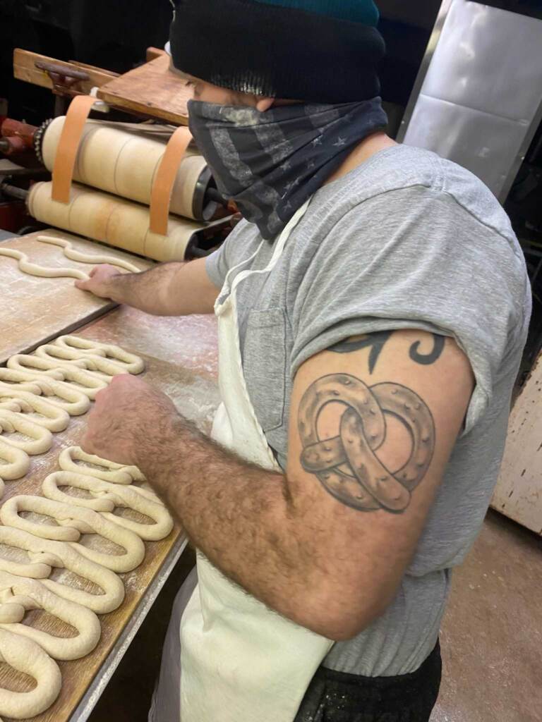 Anthony Panara hand-twists some pretzels