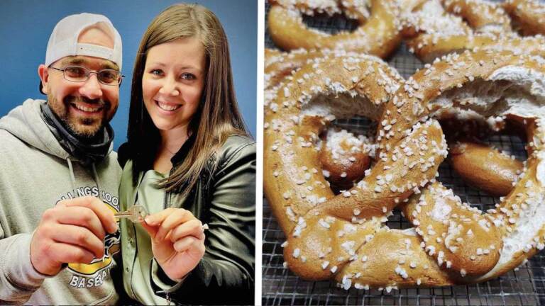 Anthony Panara and Charlene Delia hold up a key to their pretzel shop; a closeup of a soft pretzel