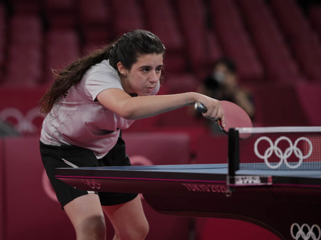 Syria’s Hend Zaza competes during women’s table tennis singles preliminary round match against Austria’s Liu Jia at the 2020 Summer Olympics in Tokyo. Syria's Hend Zaza competes during women's table tennis singles preliminary round match against Austria's Liu Jia at the 2020 Summer Olympics in Tokyo. (Kin Cheung/AP)