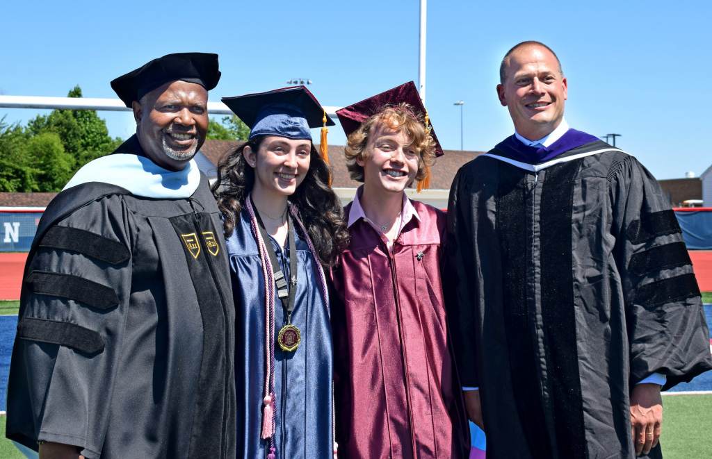 Eastern principal Dr. Robert Tull; salutatorian Arianna Reischer; Bryce Dershem; and Superintendent Robert Cloutier pose for pictures
