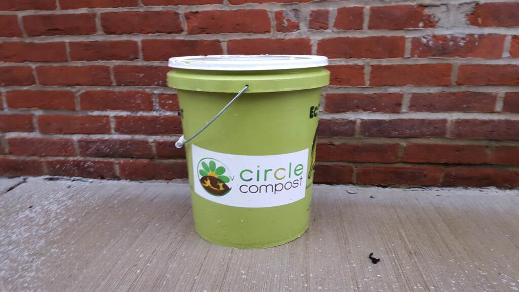 A compost bin sits on a Philadelphia sidewalk