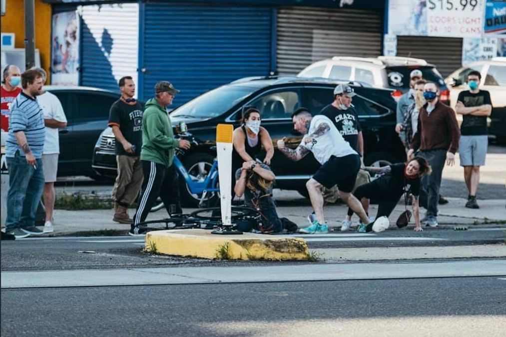 fishtown_mob_bat_CB_060220 A group of people attack a man who has been knocked off his bike