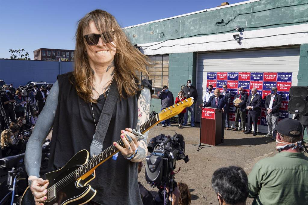 Musician Laura Jane Grace will perform at Four Seasons Total Landscaping in a sold-out concert in August 2021 BILLY PENN ILLUSTRATION VIA AP