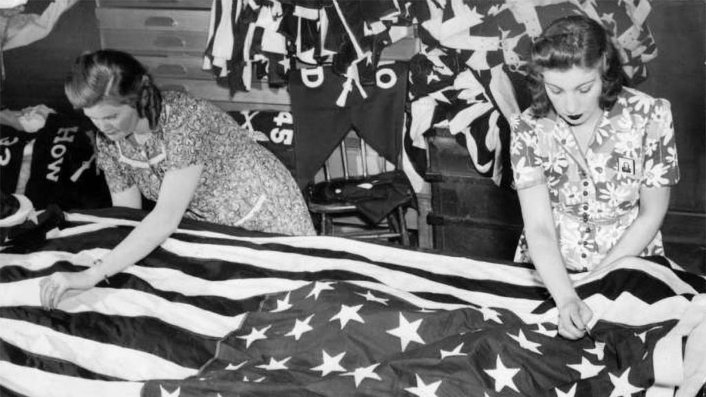 Grace Stanton stitches a large flag for the 1951 Fourth of July celebration in Fairmount Park PHILADELPHIA EVENING BULLETIN / TEMPLE UNIVERSITY ARCHIVES