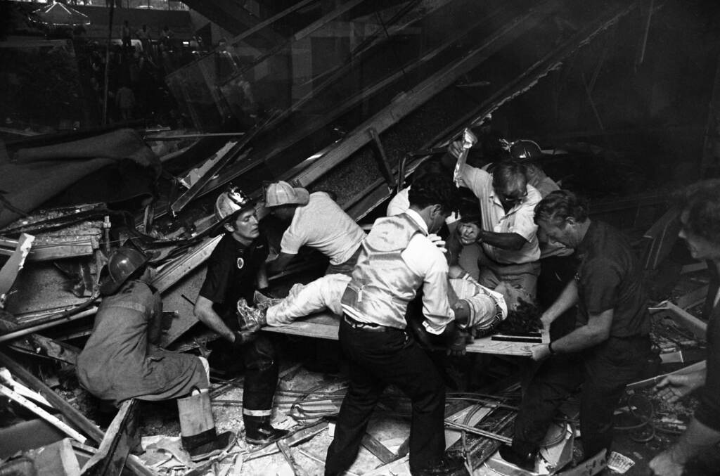 Firefighters rescue people from under a collapsed walkway in the lobby of the Hyatt Regency Hotel in Kansas City, Mo., on July 17, 1981. The collapse killed 114 people and injured more than 200. Firefighters rescue people from under a collapsed walkway in the lobby of the Hyatt Regency Hotel in Kansas City, Mo., on July 17, 1981. The collapse killed 114 people and injured more than 200. (Bettmann Archive/Getty Images)