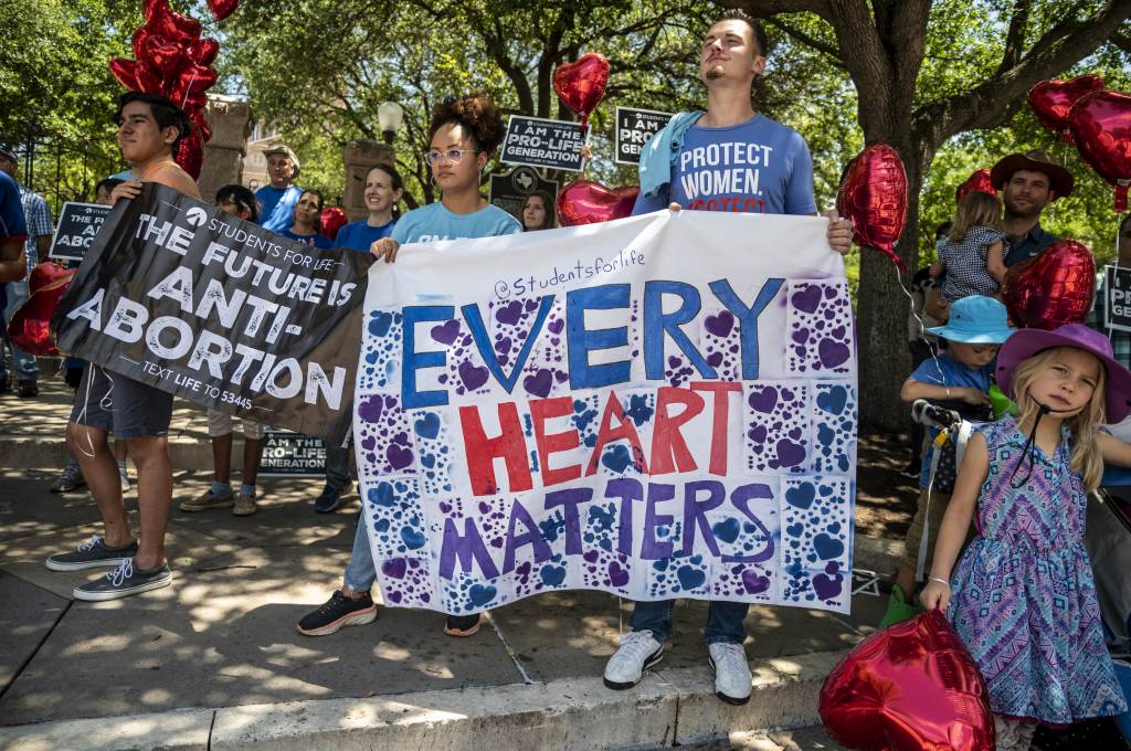 Anti-abortion-rights protesters come out in May to the Texas Capitol in Austin in response to a bill that Gov. Greg Abbott signed outlawing abortions after a fetal heartbeat is detected. Thousands of pro-life demonstrators came out to protest outside the Texas state capitol last month in Austin, in response to a bill signed by Gov. Greg Abbott outlawing abortions after a fetal heartbeat is detected. (Sergio Flores/Getty Images)