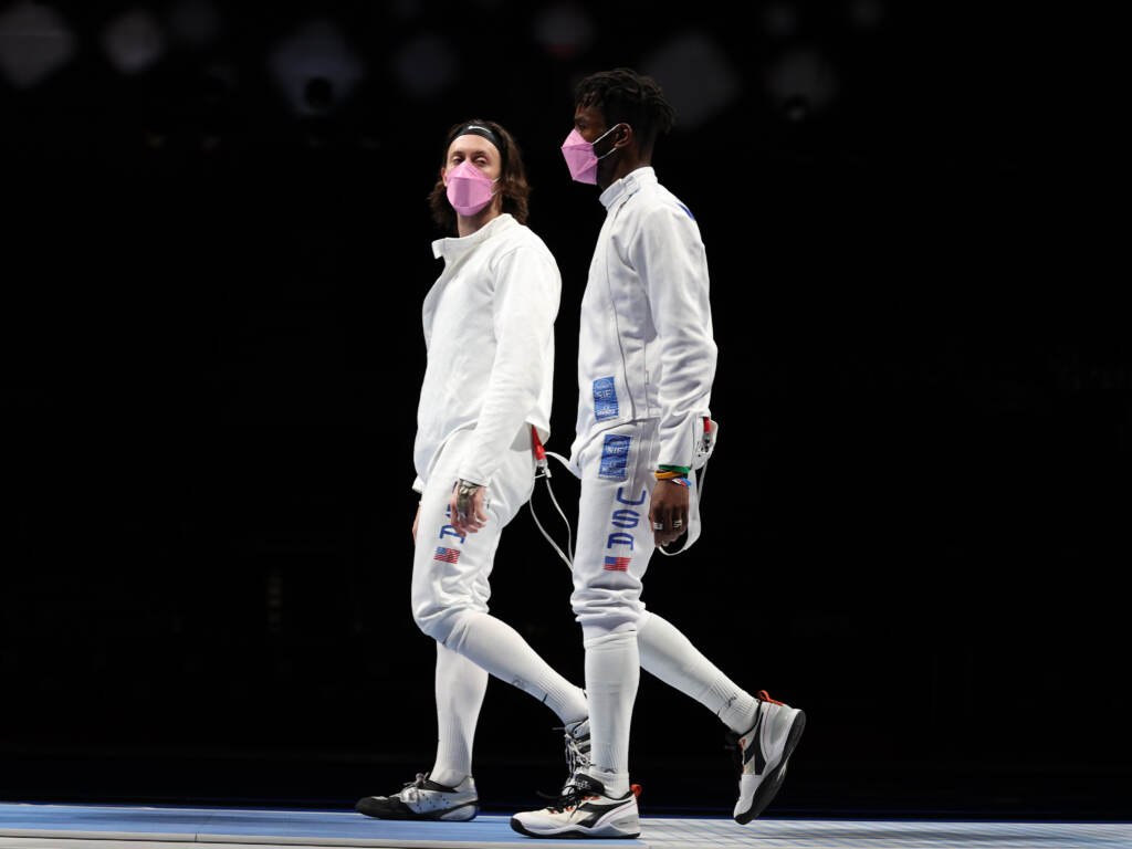 American’s Jacob Hoyle and Curtis McDowald wear pink face masks after losing to Japan in Men’s Épée. American's Jacob Hoyle and Curtis McDowald wear pink face masks after losing to Japan in Men's Épée. (Elsa/Getty Images)