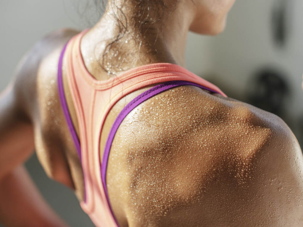 Woman sweating while working out (Cavan Images/Getty Images/Cavan Images RF)