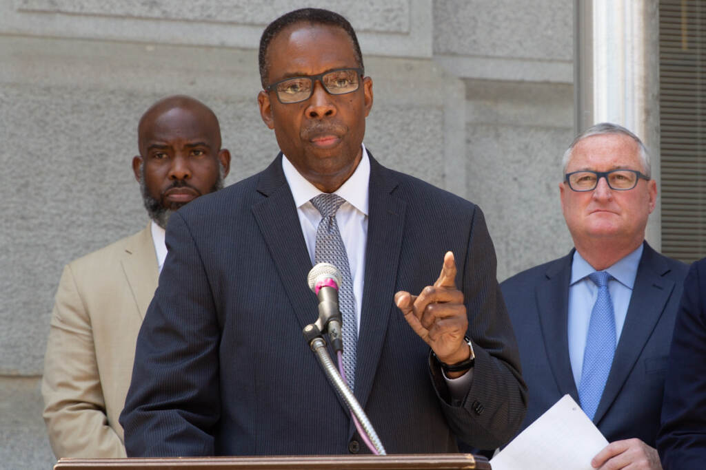 gun_violence_prevention_city_jall_KP_072821_04 Darrell Clarke gestures while speaking from a podium, with other elected officials behind him