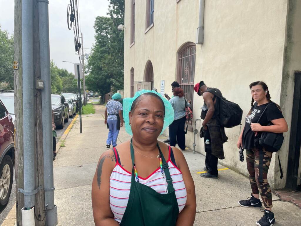joann matthews Joanne Matthews of the Emmanuel Dining Room exhorted people in line to get the shot. (Cris Barrish/WHYY)