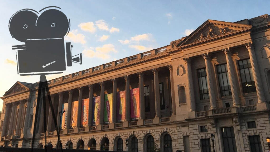 An illustration of a film projector overlays an image of the Philly Free Library