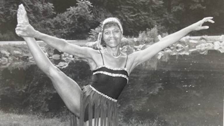 Dancer lone Nash holds her leg in the air