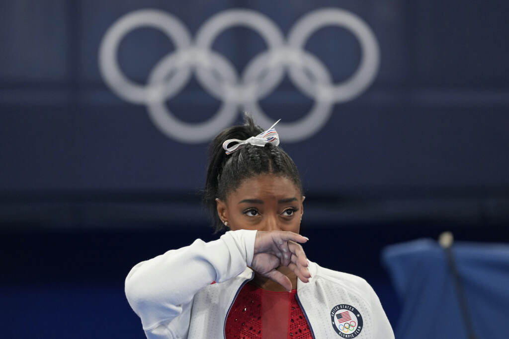APTOPIX Tokyo Olympics Artistic Gymnastics Simone Biles watches gymnasts perform after she exited the team
