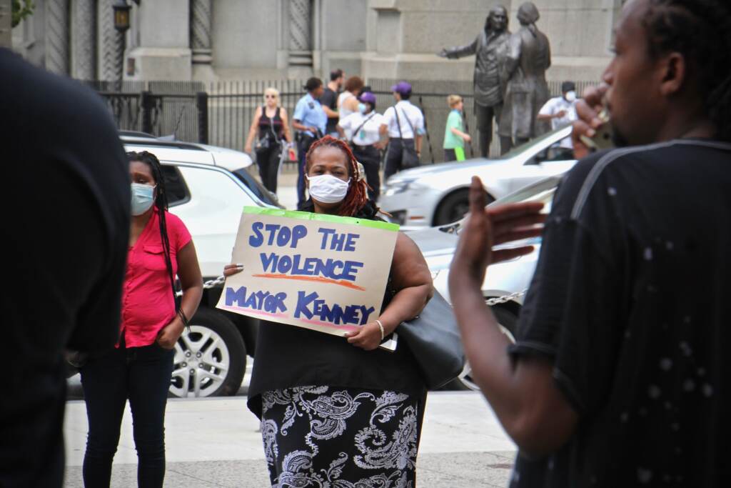 2021 08 02-e lee-christina morton-philadelphia city hall-anti gun violence rally Christina Morton carries a sign outside City Hall during a rally