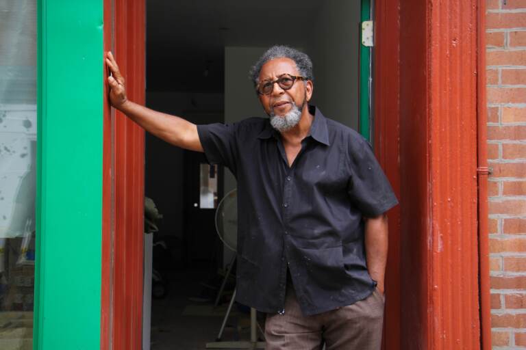 James Dupree stands in the doorway of his Queen Village gallery