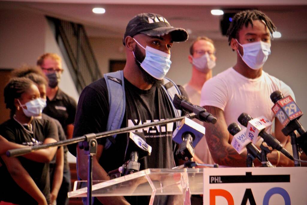 2021 08 16-e lee-james aye-philadelphia-district attorney grants to anti-violence groups James Aye, wearing a mask, speaks at a DAO press conference