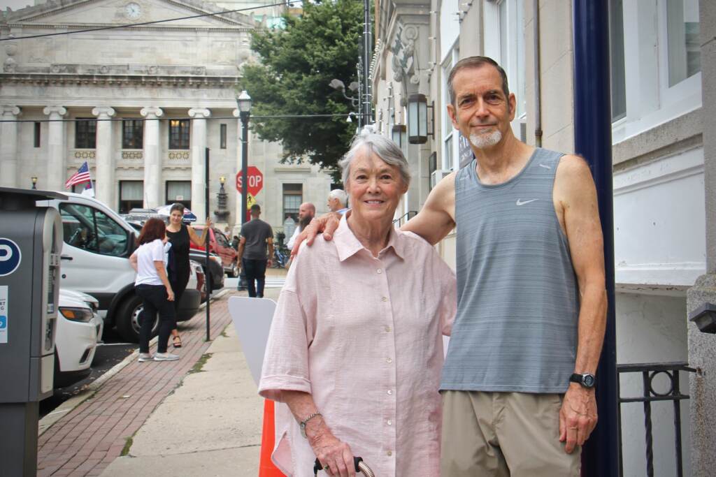 2021 08 18-e lee-bonnie raines keith forsyth-media pa-fbi breakin 50th anniversary Fifty years ago, Bonnie Raines and Keith Forsyth were among a group of activists who broke into an FBI office in Media, Pa. and made off with classified documents exposing illegal FBI investigations. They are standing at the site where a historical marker will commemorate the break-in. (Emma Lee/WHYY)