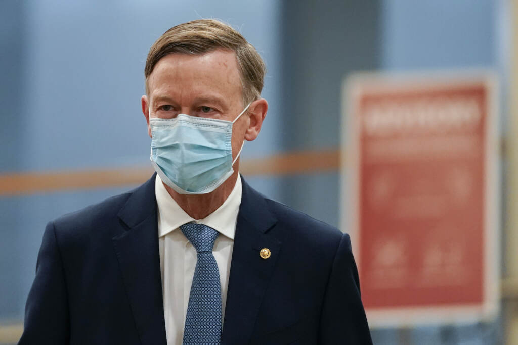 Virus Outbreak Senate FILE - In this Feb. 13, 2021, file photo, Sen. John Hickenlooper, D-Colo., arrives on Capitol Hill in Washington