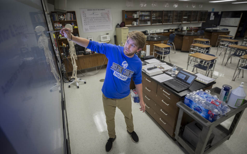 Virus Outbreak Johnson County High School teacher Michael Caneege teaches anatomy to his students online, Friday, Aug., 20, 2021, in Wrightsville, Ga. A few weeks into the new school year, growing numbers of U.S. districts have halted in-person learning or switched to hybrid models because of rapidly mounting coronavirus infections. With 40% of students in quarantine or isolation, the Johnson County district shifted last week to online instruction until Sept. 13. (AP Photo/Stephen B. Morton)