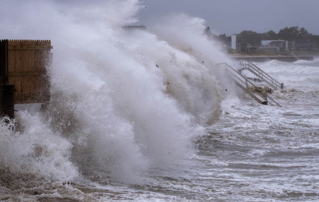 Waves pound seawall in Montauk, N.Y., Sunday, Aug. 22, 2021, as Tropical Storm Henri affects the Atlantic coast. (AP Photo/Craig Ruttle)