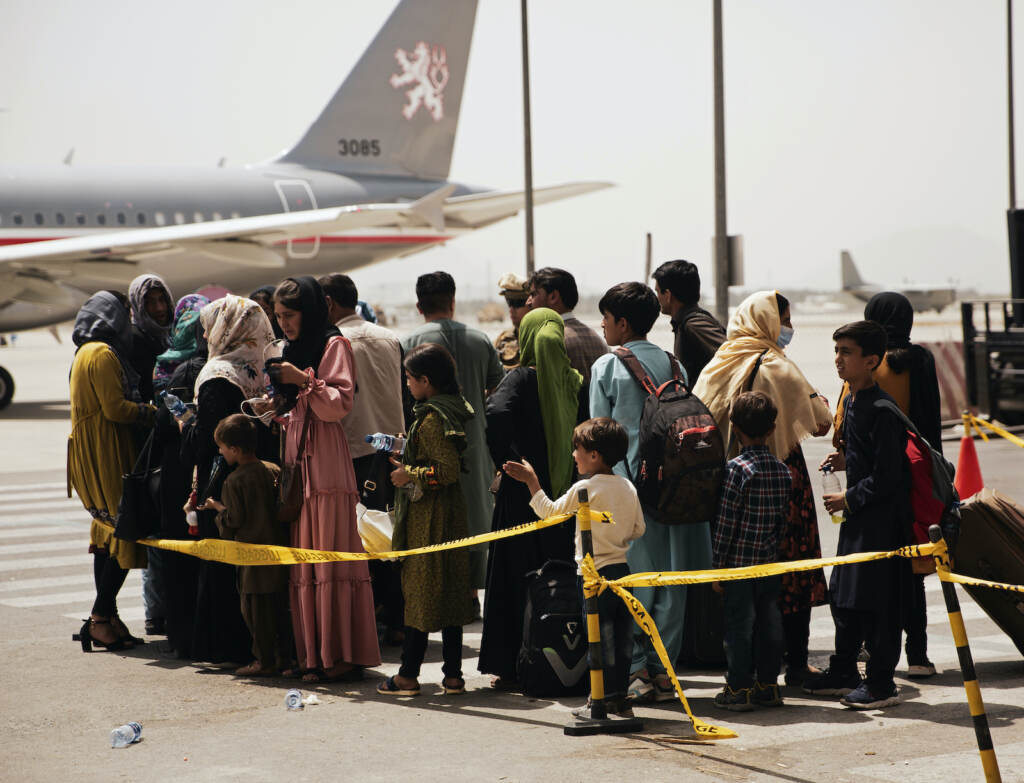 Afghanistan Civilians prepare to board a plane at Hamid Karzai International Airport