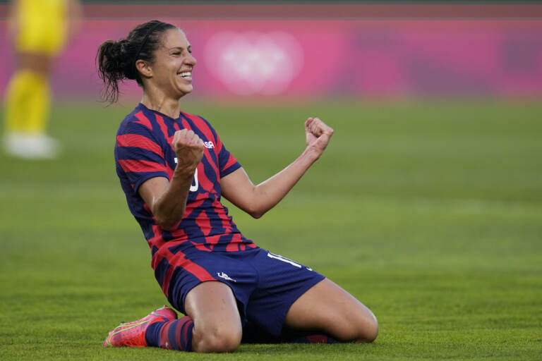 Carli Lloyd celebrates scoring in the Tokyo Olympics