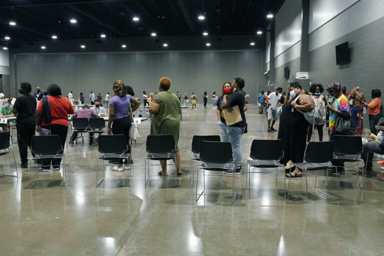 Applicants line up at a rental assistance fair