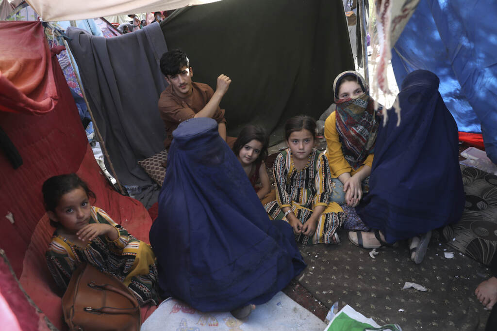 Afghanistan Women Internally displaced school teacher wearing a burqa from Takhar province, who identified herself by her first name, Nilofar, inside her tent in a public park in Kabul, Afghanistan on August 13, 2021. Many women in Afghanistan remain at home because they are too terrified to venture into a new world ruled by the Taliban.. (AP Photo/Rahmat Gul, File)
