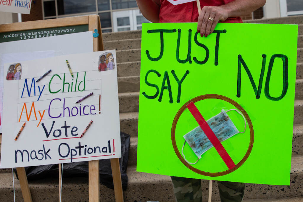 IMG_1424 Two parents held signs outside the North Penn school district board meeting against mask mandates in the classrooms