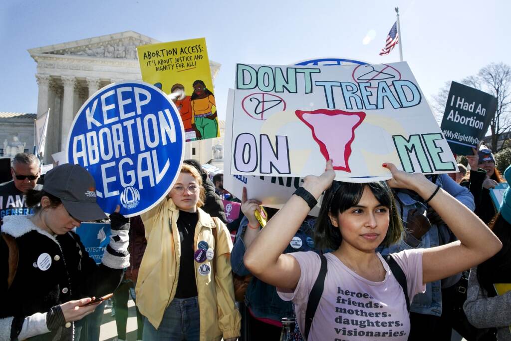 In this March 4, 2020, file photo, abortion rights demonstrators rally outside the Supreme Court in Washington. Among abortion-rights activists, (AP Photo/Jacquelyn Martin, File)