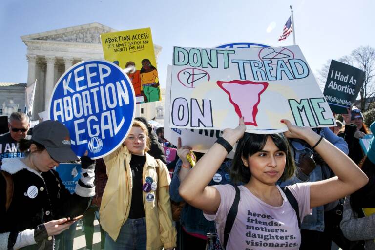 In this March 4, 2020, file photo, abortion rights demonstrators rally outside the Supreme Court in Washington. Among abortion-rights activists, (AP Photo/Jacquelyn Martin, File)