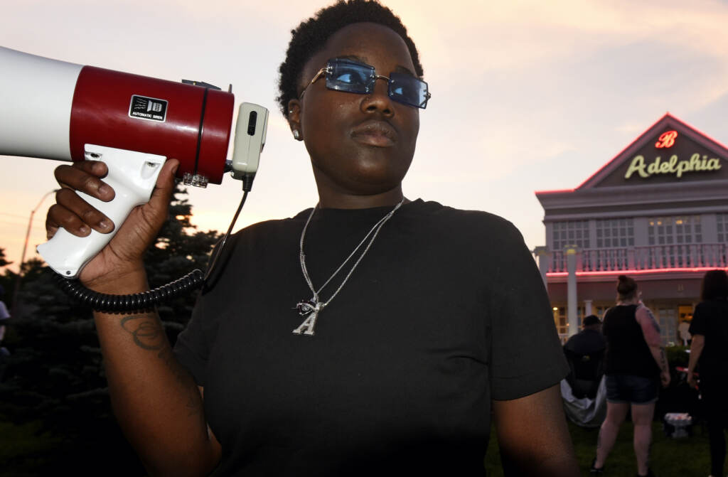 adelphia_protest_NJ_AS_073121_07 Protester Ajahnae Weal holds a bullhorn outside Adelphia restaruant