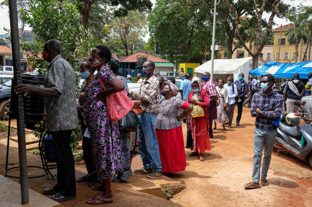 People line up last week to receive COVID-19 vaccines in Kampala, Uganda, after weeks of no supply. In Uganda, only 2.2% of the population had received one dose of a vaccine as of Aug. 15. People line up last week to receive COVID-19 vaccines in Kampala, Uganda
