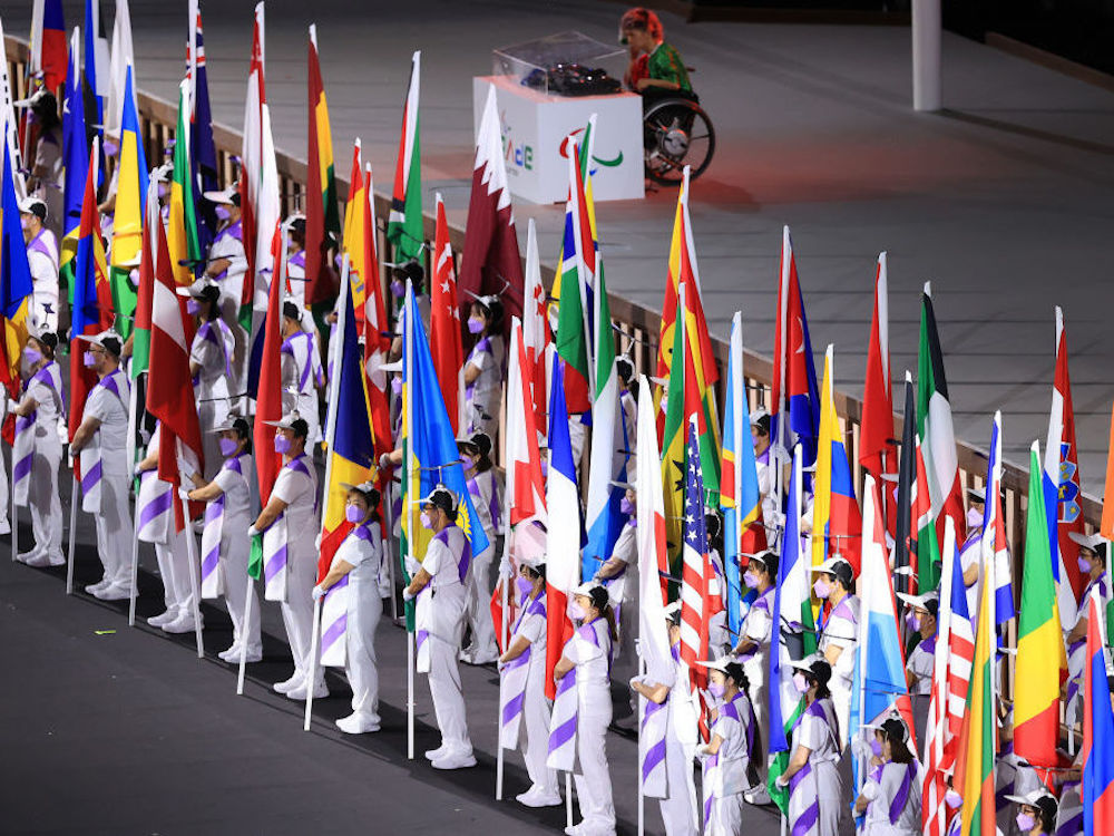 Paralympics – Opening Ceremony The flags of the participating nations are displayed in the parade of athletes during the opening ceremony of the Tokyo 2020 Paralympic Games