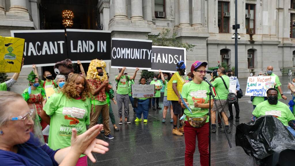 Protesters outside City Hall calling for vacant land to be given for community development