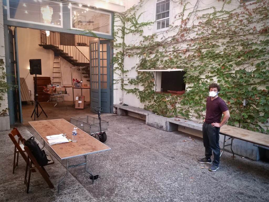 Man stands in theater patio