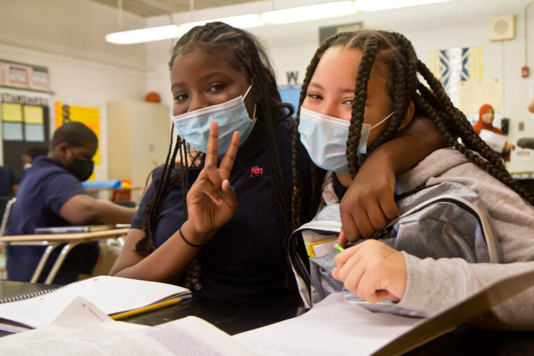 E.W. Rhodes 6th grade students London Wesley (left) and Saminh Wheeler (right) are new friends who bonded over their love of cats. (Kimberly Paynter/WHYY)